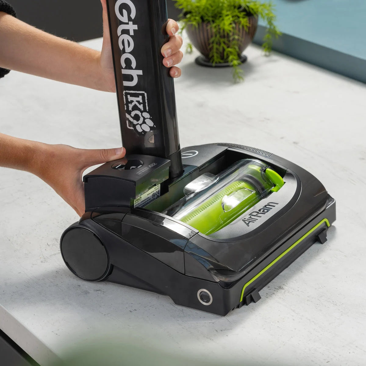 Battery being removed from AirRAM 2 K9 Pet cordless pet vacuum.