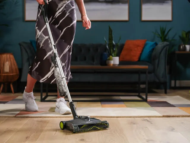 Close up of SW22 carpet sweeper with dusting brush attached to the handle.